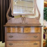 Vintage oak 4 drawer dresser with adjustable mirror .