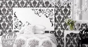 Calming the busy damask patterns on walls and bed cover with black .