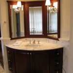 Elegant corner bathroom vanity with marble sink countertop design .