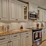 Image result for white cabinets with Antique Mascarello counter .