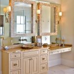 Decorative mirrors mounts on top of large wall mirror adds depth .