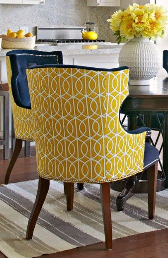 chairs upholstered in two different fabrics can have real pop .