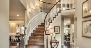 Traditional Entryway with Wainscoting, High ceiling, Chandelier .