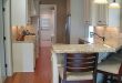 Galley kitchen with peninsula breakfast bar … | Kitchen remodel .