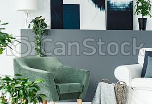 Green armchair in room. Green armchair standing in white living .