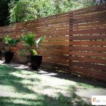 Horizontal board fence design. This fence was made from ironwood .