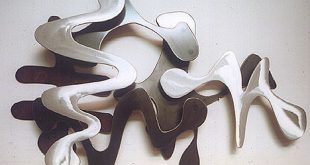 Osmosis abstract mixed metal wall sculpture by sculptor Bruce Gr