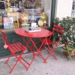 I adore this little poppy red bistro table ~ made in Franc