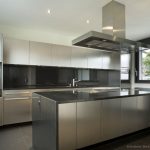 Stainless Steel Kitchen Cabinets with Black Granite Countertops .