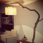 Unique floor lamp / Arc Lamp. made of oak branch, on natural stone .