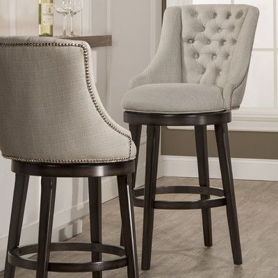 Features: -360 degree swivel stool. -Armchair design. -Nailhead .