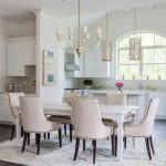 White Farmhouse Dining Table with Glass and Brass Chandelier .