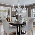 Modern crystal dining room chandeliers with white chairs .