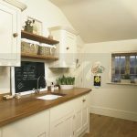 cream and oak kitchen ideas | Image: Blackboard above sink in .