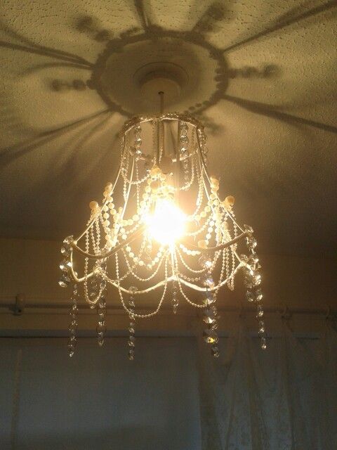My homemade chandelier using strings of pearls, crystals and an .