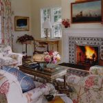 delft-tile-fireplace-chintz-sofa-chairs-sea-art - The Glam P