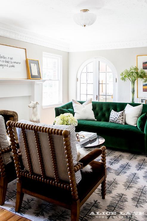 Emerald Green Velvet Tufted Sofa with Spindle Chairs .