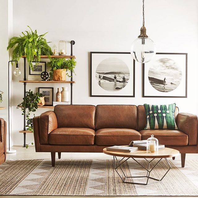 The sharped edged brown couch provides contrast to this design. Th .
