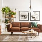 Tan leather sofa with pendant light | Leather couches living room .