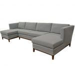 Large Quatrine slipcovered chaise sectional with wood base .