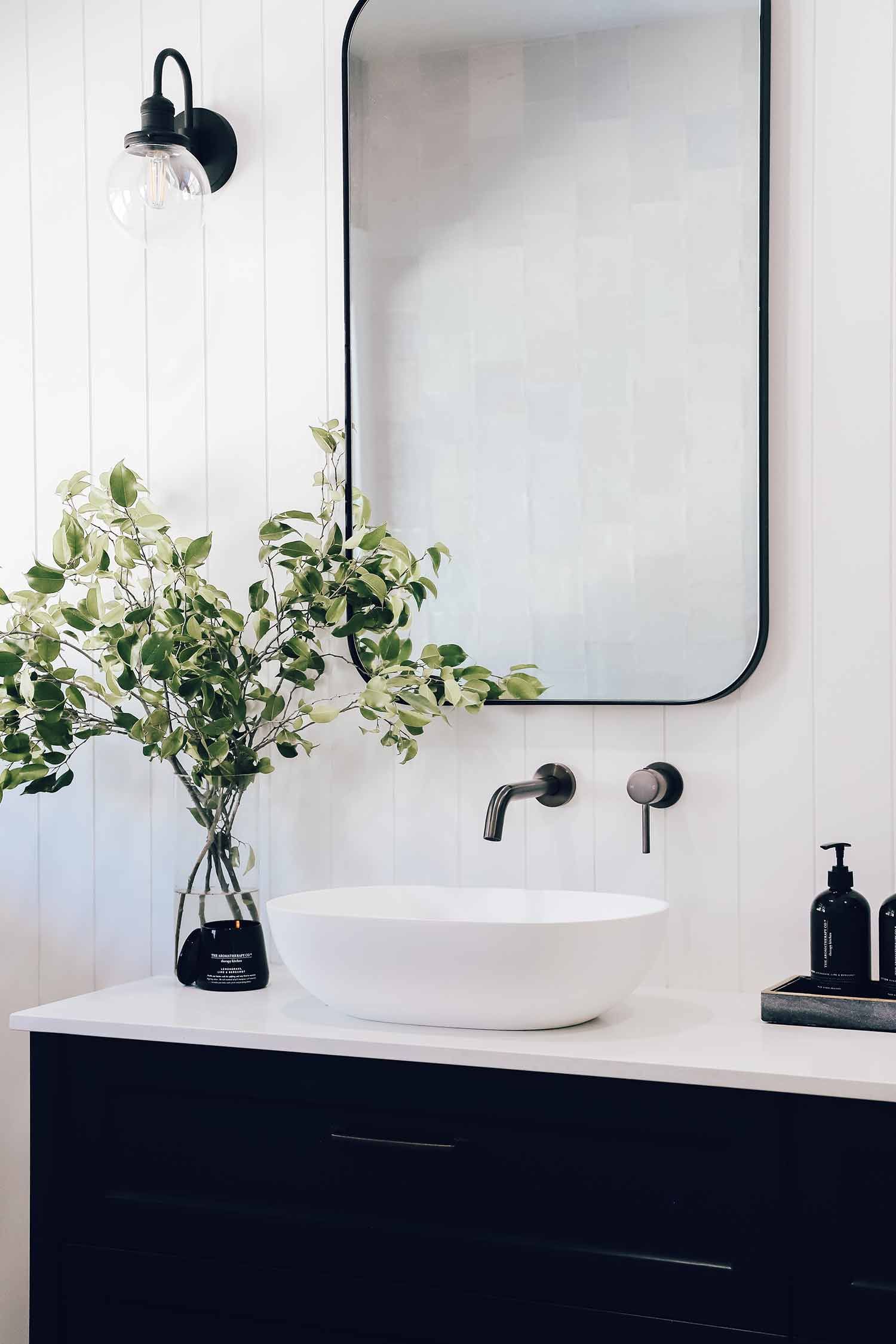 Bold Contrast: Embracing the Trend of White Bathrooms with Black Taps