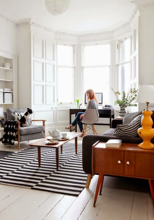 Bold and Timeless: Embracing the Modern Black and White Striped Rug Trend in Your Living Room