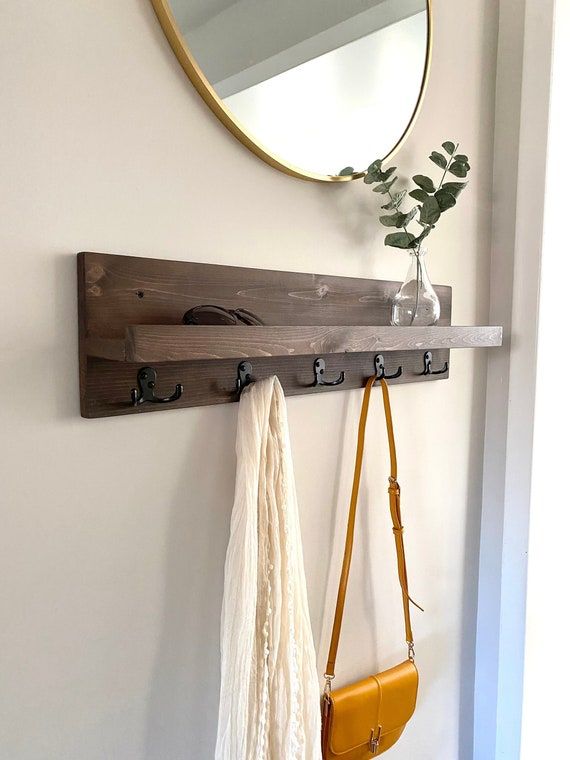 Enhance Your Entryway with Organization: The Benefits of an Entryway Mirror with Hooks and Shelf