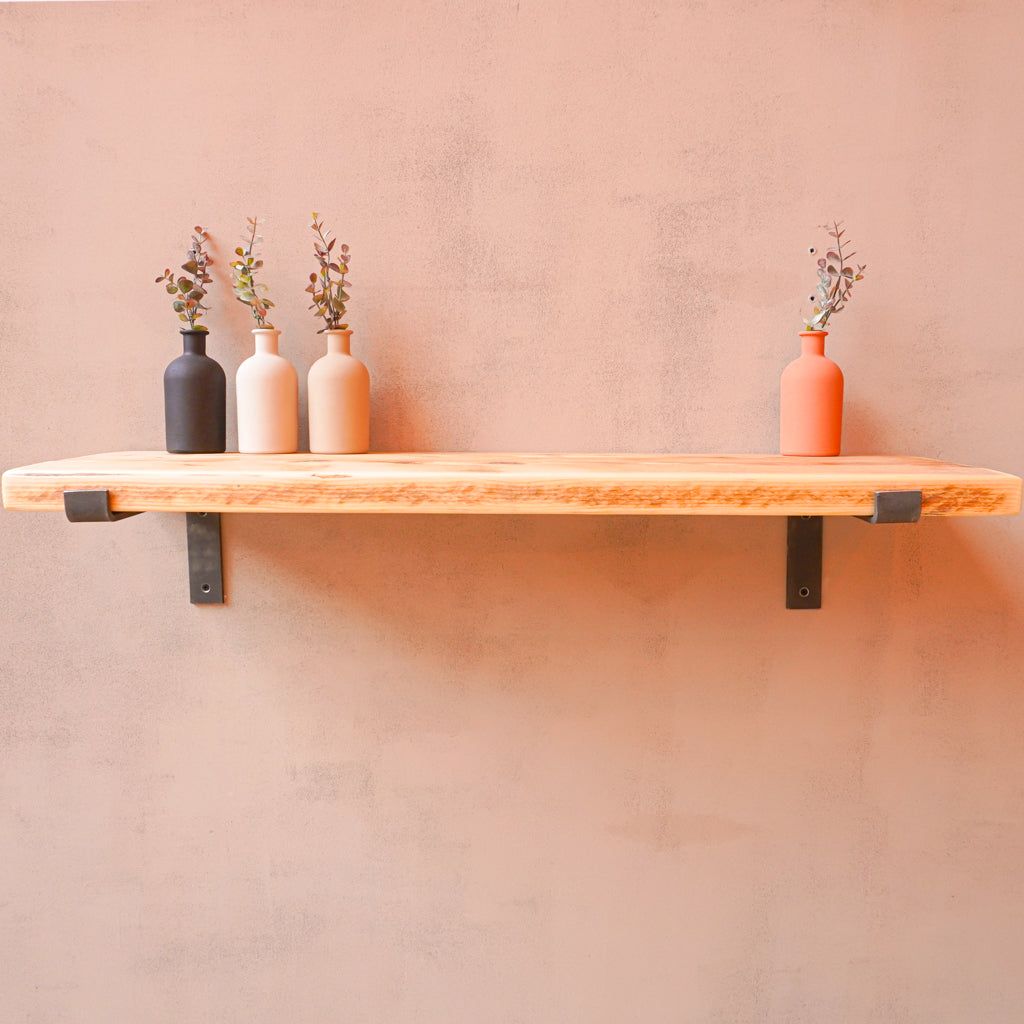 Enhance Your Home Decor with a Stylish Reclaimed Wood Shelf Featuring Industrial Brackets