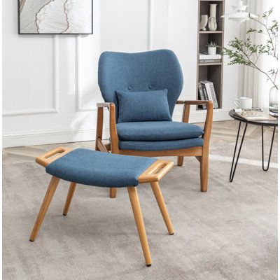Stylish Comfort: The Elegance of a Blue Leather Chair and Ottoman Set
